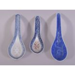 THREE CHINESE PORCELAIN SPOONS, various styles, largest 15cm long.