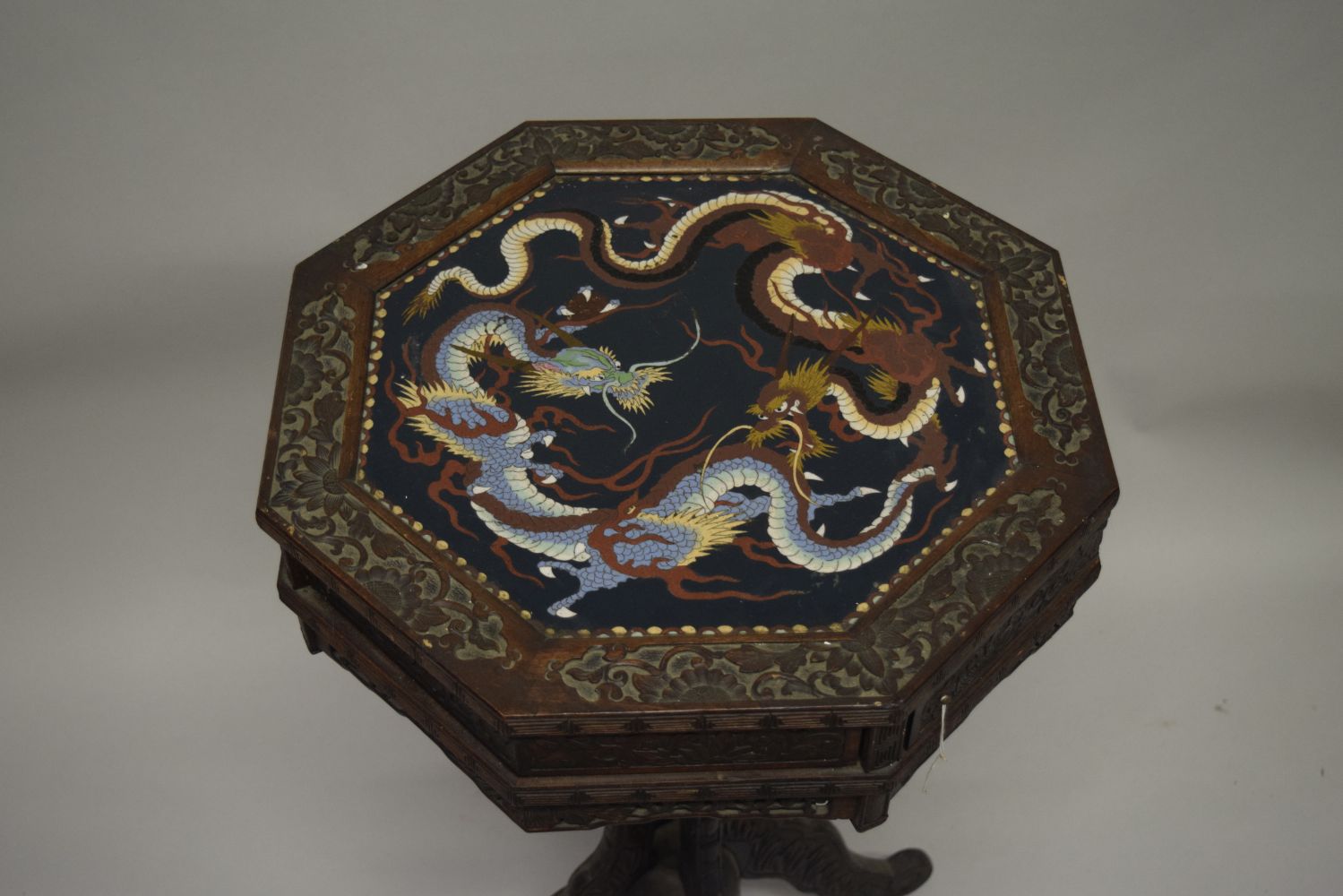 AN UNUSUAL CHINESE OCTAGONAL CARVED HARDWOOD PEDESTAL TABLE, the top inset with a cloissonne panel - Image 2 of 7