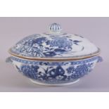 A CHINESE BLUE AND WHITE PORCELAIN CIRCULAR TUREEN AND COVER, painted with native flora, the