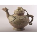 A CHINESE BRONZE ARCHAIC STYLE TEAPOT, with zoomorphic handle, spot and finial, 20cm high.