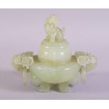 A CHINESE CARVED JADE KORO AND COVER, with carved ring handles, the cover with carved lion dog,