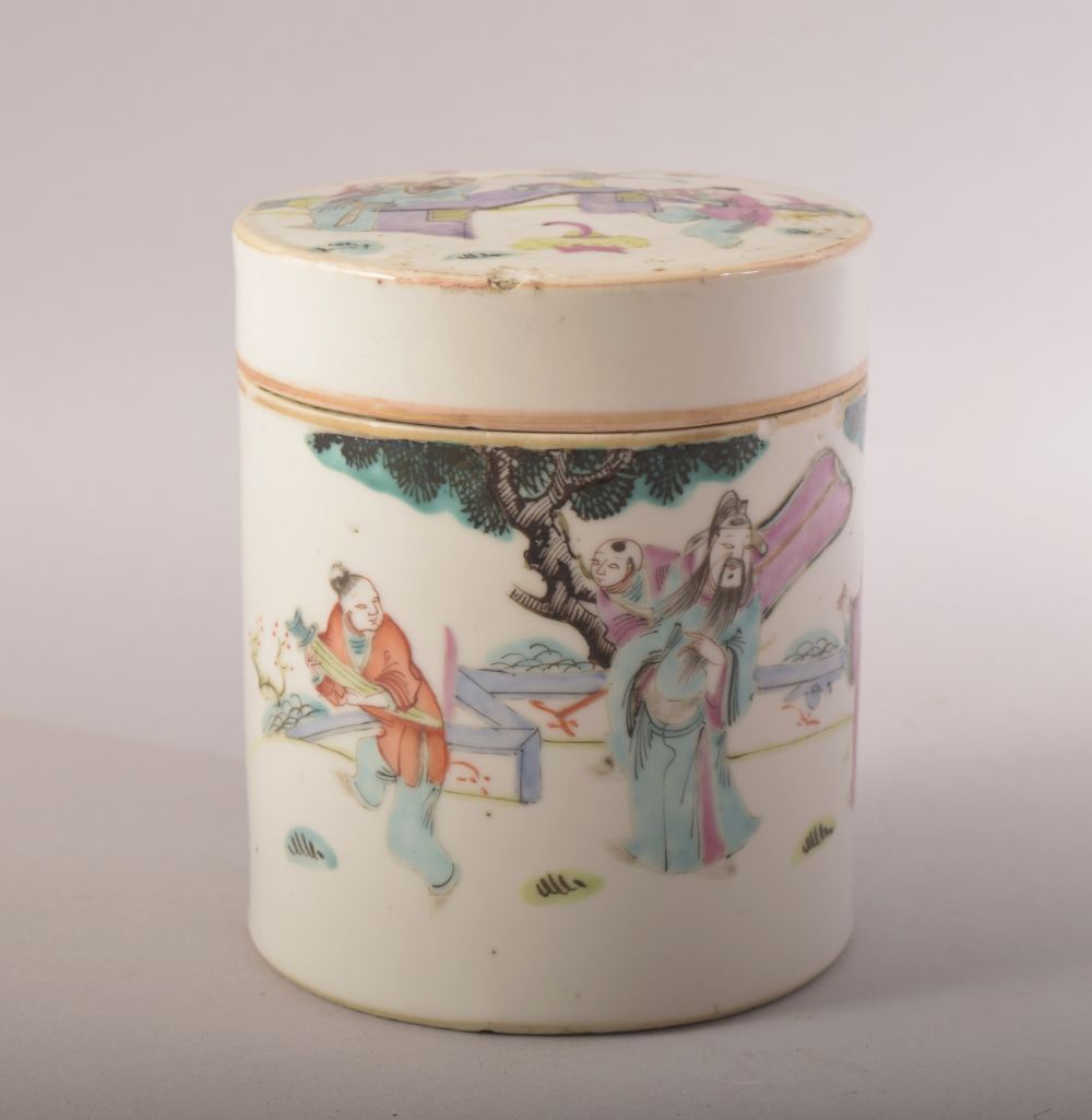 A CHINESE PORCELAIN CYLINDRICAL POT AND COVER, painted with figures in an outdoor setting, 12cm