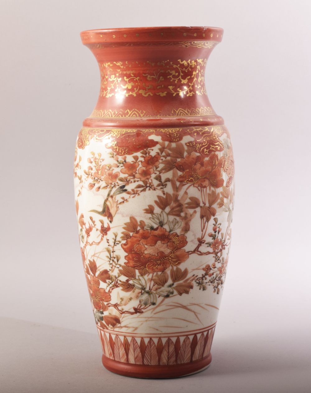 A JAPANESE KUTANI PORCELAIN VASE, painted with birds, native flora and gilt highlights, 30.5cm