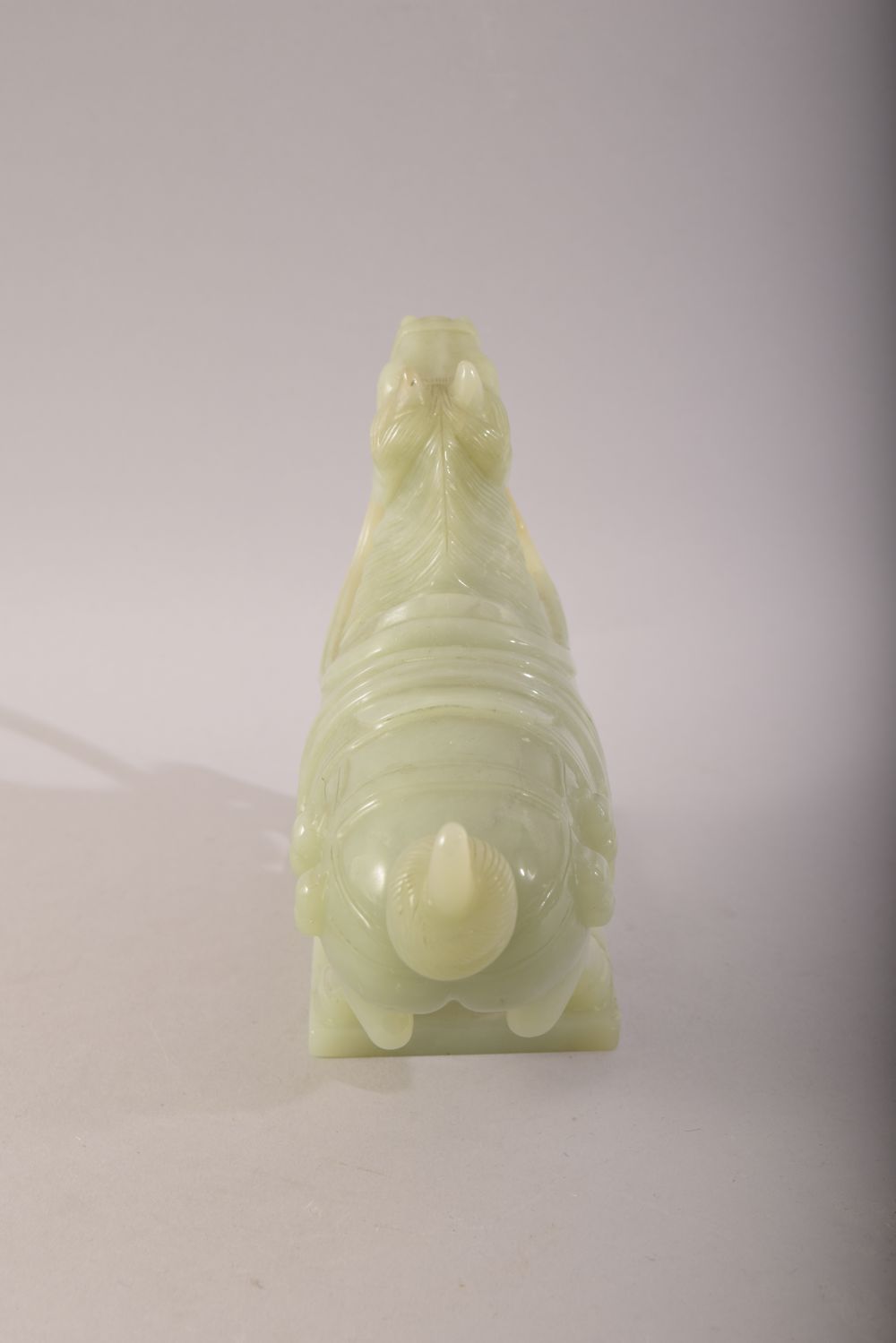 A CHINESE CARVED JADE MODEL OF A HORSE, with a wooden stand, figure 20cm long. - Image 5 of 7