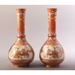 A PAIR OF JAPANESE KUTANI PORCELAIN VASES, each painted with a panel depicting two figures at a