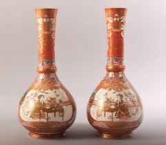 A PAIR OF JAPANESE KUTANI PORCELAIN VASES, each painted with a panel depicting two figures at a