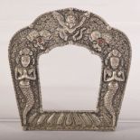 AN INDIAN OR NEPALESE WHITE METAL FRAME, 11.5cm x 11cm.