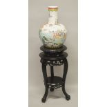 A LARGE LATE 19TH / EARLY 20TH CENTURY CHINESE FAMILLE ROSE PORCELAIN IMMORTAL VASE & STAND - the