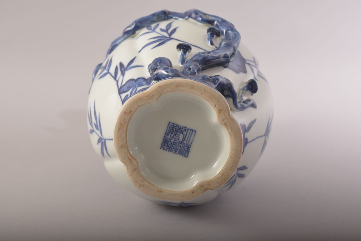 A CHINESE BLUE AND WHITE PORCELAIN VASE, with moulded relief peach tree decoration, the body with - Image 6 of 7
