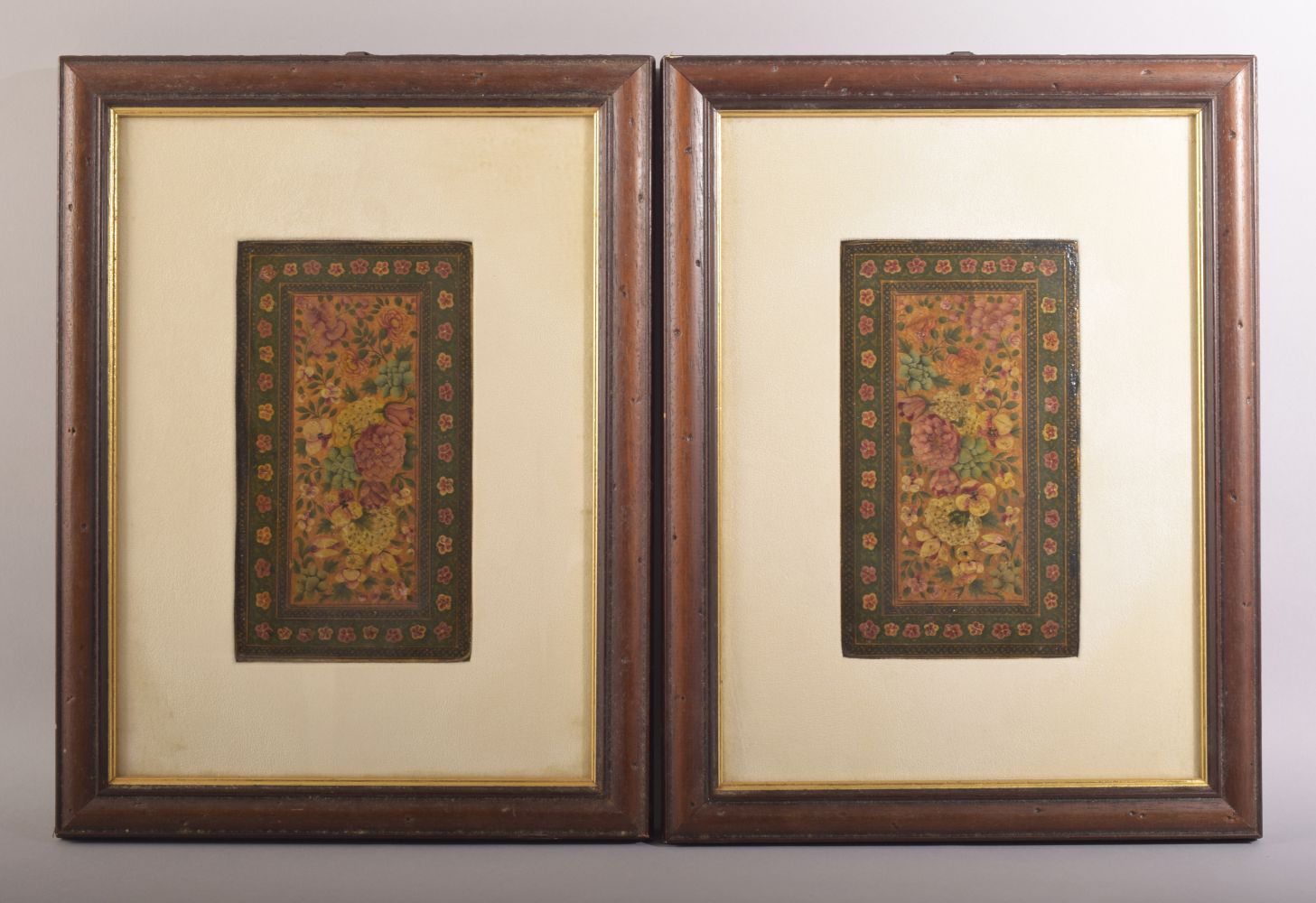 AN EARLY PAIR OF PERSIAN PANELS / COVERS - possibly for a mirror or Quran, painted with flowers,