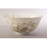 A CHINESE FAMILLE VERTE PORCELAIN BOWL, decorated with native flora, six character mark to base,