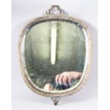 A CHINESE WHITE METAL CARVED WALL MIRROR - the mirror encapsulated with a white metal body, the