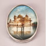 A SIKH SCHOOL OVAL MINIATURE PAINTING of The Golden Temple, Punjab, encased within a silver mount,