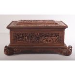 A FINE ANGLO INDIAN CARVED SANDALWOOD BOX, beautifully carved with scenes of animals and figures