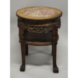 A CHINESE CARVED HARDWOOD MARBLE TOP STAND, the frieze and legs carved with foliate decoration,