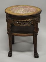 A CHINESE CARVED HARDWOOD MARBLE TOP STAND, the frieze and legs carved with foliate decoration,