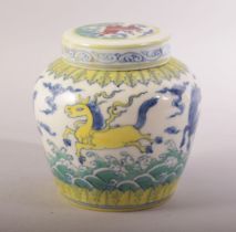 A CHINESE PORCELAIN DOUCAI JAR AND COVER, painted in the typical doucai palette with horses and