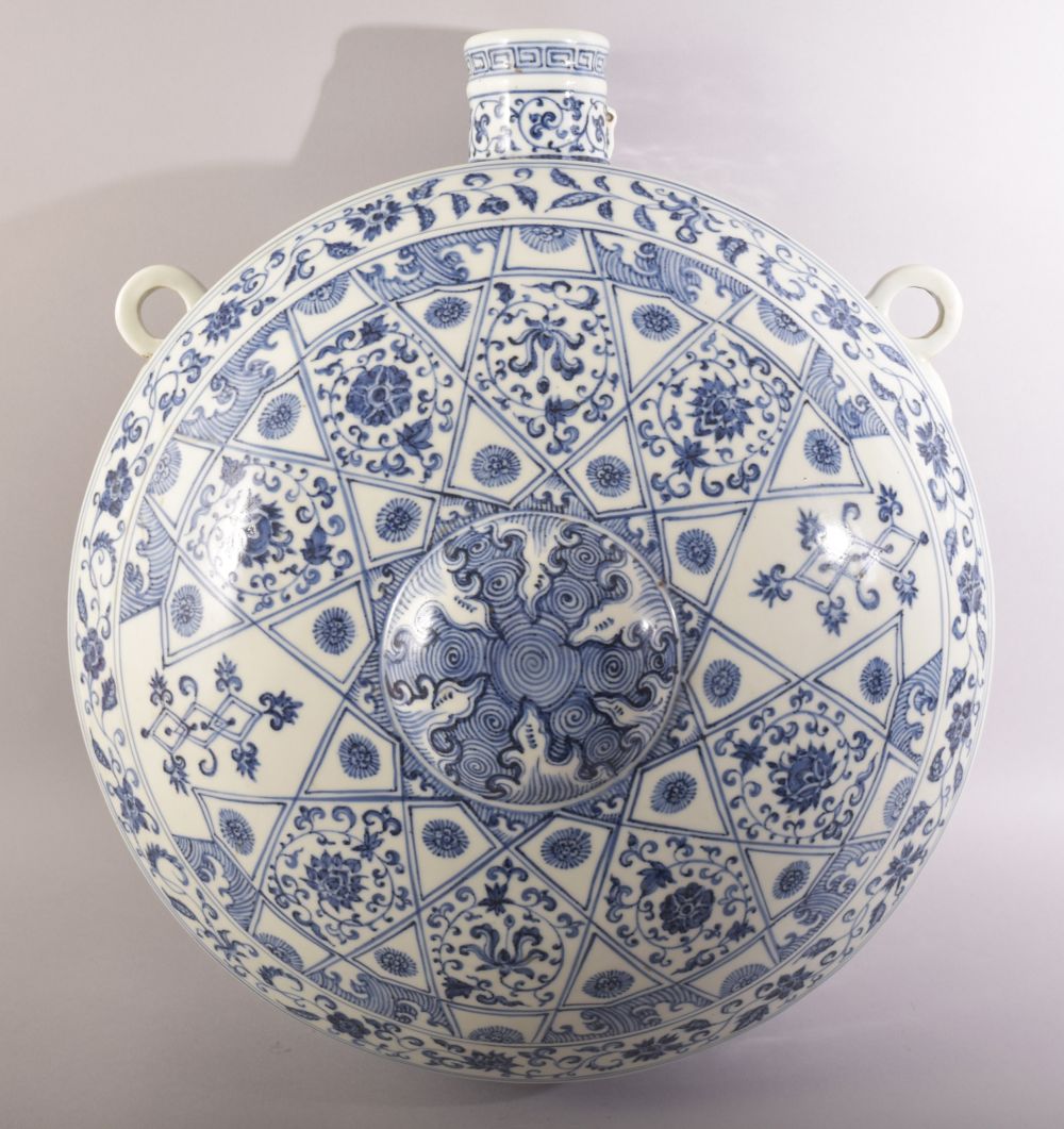 A LARGE AND IMPRESSIVE BLUE AND WHITE MING STYLE PORCELAIN MOON FLASK VASE, painted all over with