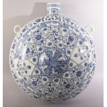 A LARGE AND IMPRESSIVE BLUE AND WHITE MING STYLE PORCELAIN MOON FLASK VASE, painted all over with