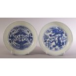 A PAIR OF CHINESE BLUE AND WHITE PORCELAIN DISHES, one painted with a dragon, the other with