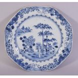 A CHINESE BLUE AND WHITE PORCELAIN DISH, painted with native flora, 22cm diameter.