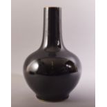 A CHINESE FAMILLE NOIR BULBOUS PORCELAIN VASE, with six character mark to base, 33cm high.