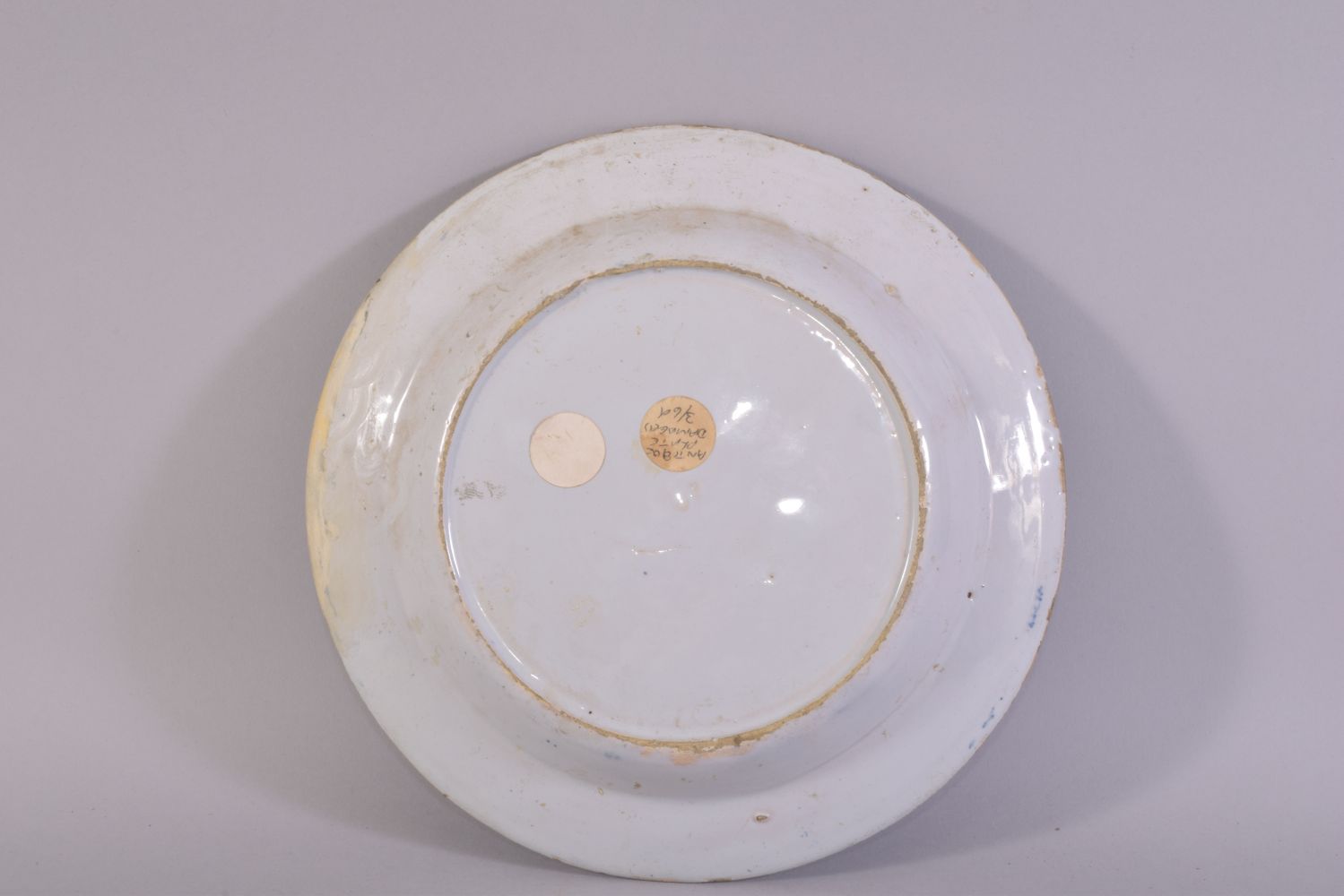 A CHINESE BLUE AND WHITE PORCELAIN PLATE, painted central with a figure beside a tree, 23cm - Image 2 of 2
