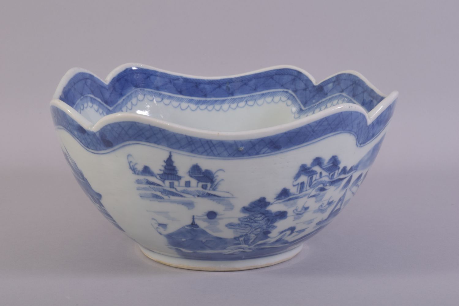 A CHINESE BLUE AND WHITE PORCELAIN BOWL, decorated with a landscape including buildings, boats and - Image 2 of 6