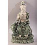A CHINESE DEHUA PORCELAIN FIGURE OF GUANYIN & ELEPHANT - the goddess seated upon the back of an