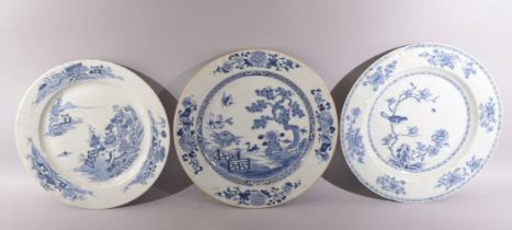 THREE LARGE CHINESE BLUE AND WHITE PORCELAIN DISHES, one painted with a landscape and buildings, one