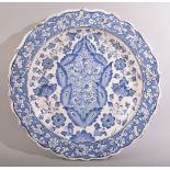 AN OTTOMAN STYLE, POSSIBLY EUROPEAN GLAZED POTTERY DISH, profusely decorated with floral sprays,