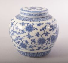 A GOOD CHINESE BLUE AND WHITE PORCELAIN JAR AND COVER, painted with phoenix, lotus and scrolling