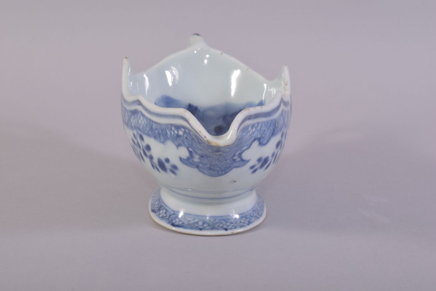 A CHINESE BLUE AND WHITE PORCELAIN SAUCE BOAT, the interior decorated with native flora, 21.5cm - Image 2 of 6