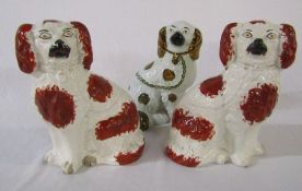 Pair of Staffordshire dogs H 25 cm and one other H 23 cm