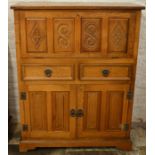 Mid to late 20th century drinks cabinet in oak with carved panels Ht118cm W91cm D38cm