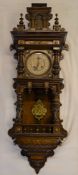 Vienna regulator wall clock in an ornate walnut case with brass embellishments & a 2 train spring