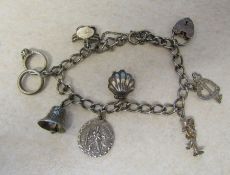 Silver charm bracelet with silver and white metal charms total weight 0.86 ozt / 26.6 g