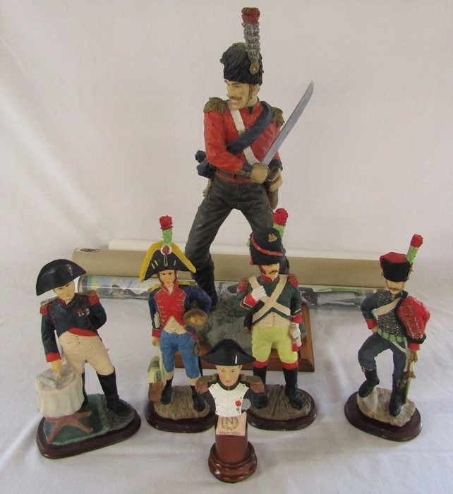 Selection of resin military figurines (tallest 53 cm) and 4 military posters