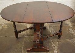 Titchmarsh and Goodwin reproduction oak gate leg table, 137cm by 106cm Ht72cm