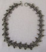 Contemporary silver necklace, cast as a string of bumble bees, marked with Birmingham hallmark and