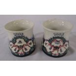 Pair of Moorcroft mugs dated 2003, one signed by the artist - open day