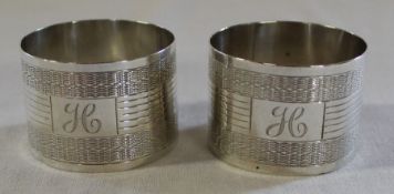 Pair of silver napkin rings with engine turned decoration and initialled H,  Birmingham 1920 1.5ozt