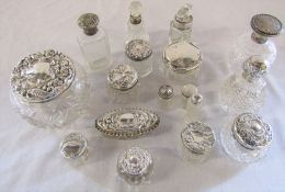 Various silver topped perfume bottles and trinket / dressing table pots