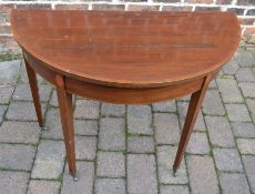 Edwardian mahogany circular foldover card table on square tapered legs