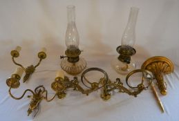 2 paraffin lamps with brass wall brackets, 2 electric wall lights, small gilded bracket & a sword