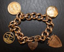 9ct gold curb chain bracelet with 2 fobs, locket & 1914 full sovereign in 9ct gold mount total