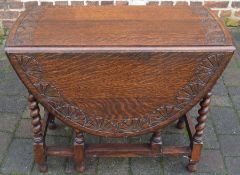 Carved oval oak gateleg table with barley twist legs 122cm by 92cm