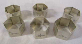 6 white metal middle eastern napkin rings decorated with palm trees, boats and camels etc total