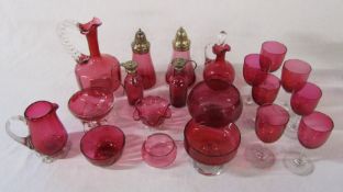 Selection of cranberry glass inc sugar sifter, glasses and bowls