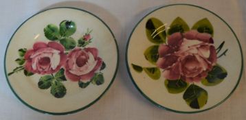2 Wemyss ware dishes. Approx diameter 12cm (chip to foot rim of one)